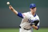 Kansas City Royals starting pitcher Brady Singer throws during the first inning of a baseball game against the Tampa Bay Rays Tuesday, July 2, 2024, in Kansas City, Mo. (AP Photo/Charlie Riedel)