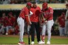 Los Angeles Angels' Luis Rengifo, right, holds his arm during the ninth inning of a baseball game against the Oakland Athletics, Wednesday, July 3, 2024, in Oakland, Calif. Rengifo left the game with an injury. (AP Photo/Godofredo A. Vásquez)