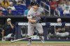 Boston Red Sox's Tyler O'Neill hits a single during the first inning of a baseball game against the Miami Marlins, Thursday, July 4, 2024, in Miami. (AP Photo/Marta Lavandier)