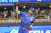 Minnesota Twins' Carlos Correa celebrates as he rounds the bases after hitting a grand slam during the ninth inning of a baseball game against the Houston Astros, Friday, July 5, 2024, in Minneapolis. Willi Castro, Christian Vazquez and Brooks Lee also scored on the hit. (AP Photo/Craig Lassig)