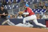 Chicago White Sox's Luis Robert Jr. (88) is caught off base as Miami Marlins first baseman Jake Burger, top right, catches the ball for an out during the first inning of a baseball game, Saturday, July 6, 2024, in Miami. (AP Photo/Marta Lavandier)