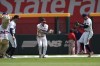 Atlanta Braves outfielders from left; Eli White, Jarred Kelenic and Adam Duvall celebrate after defeating the Philadelphia Phillies in a baseball game Sunday, July 7, 2024, in Atlanta. All three hit home runs. (AP Photo/John Bazemore)