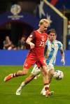 Mike Stewart / The Associated Press
                                Canada&rsquo;s Liam Millar (left) and Argentina&rsquo;s Rodrigo De Paul in action Thursday night in Atlanta.