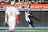 Los Angeles Dodgers right fielder Jason Heyward (23) is unable to catch a solo home run hit by Arizona Diamondbacks designated hitter Joc Pederson as shortstop Kiké Hernandez, foreground, watches during the first inning of a baseball game, Thursday, July 4, 2024, in Los Angeles. (AP Photo/Ryan Sun)