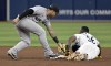 Tampa Bay Rays' Randy Arozarena (56) beats the tag from New York Yankees' Gleyber Torres to steal second base during the fifth inning of a baseball game Tuesday, July 9, 2024, in St. Petersburg, Fla. (AP Photo/Steve Nesius)