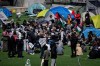 Vancouver Island University says it has issued a trespass notice to pro-Palestinian protesters, telling them to vacate their encampment on the campus in Nanaimo, B.C., by Monday. People gather and pitch tents at a pro-Palestinian encampment at the University of British Columbia campus in Vancouver, Monday, April. 29, 2024. THE CANADIAN PRESS/Ethan Cairns