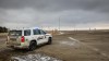The judge in the trial of two men charged with conspiracy to commit murder at the border blockade at Coutts, Alta., has cautioned the jury about an opening statement by a defence lawyer. A police vehicle looks out over an empty highway after anti-COVID-19 vaccine mandate demonstrators left their blockade of the highway at the busy U.S. border crossing at Coutts, Alta., Tuesday, Feb. 15, 2022. THE CANADIAN PRESS/