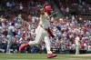 St. Louis Cardinals' Alec Burleson, right, celebrates as he rounds the bases after hitting a three-run home run off Chicago Cubs starting pitcher Hayden Wesneski, left, during the first inning of a baseball game Saturday, July 13, 2024, in St. Louis. (AP Photo/Jeff Roberson)