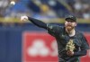 Tampa Bay Rays pitcher Zack Littlell throws during the first inning of a baseball game against the Cleveland Guardians, Saturday, July 13, 2024, in St. Petersburg, Fla. (AP Photo/Chris Tilley)