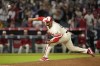 Los Angeles Angels relief pitcher Carlos Estevez throws to the plate during the ninth inning of a baseball game against the Seattle Mariners Saturday, July 13, 2024, in Anaheim, Calif. (AP Photo/Mark J. Terrill)