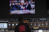 A person watches news in a local bar near the Fiserv Forum watching news ahead of the 2024 Republican National Convention, Saturday, July 13, 2024, in Milwaukee. THE CANADIAN PRESS/AP, Matt Rourke