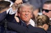 FILE - Republican presidential candidate former President Donald Trump reacts following an assassination attempt at a campaign event in Butler, Pa., on Saturday, July 13, 2024. Trump Media surged in the first day of trading, Monday, July 15, following the assassination attempt. (AP Photo/Gene J. Puskar, File)