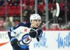 Winnipeg Jets defenceman Ville Heinola (14) takes a shot on net while taking on the Ottawa Senators in first period pre-season NHL hockey action in Ottawa on September 29, 2023. THE CANADIAN PRESS/Sean Kilpatrick
