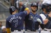 Tampa Bay Rays' José Caballero, left, and Alex Jackson celebrate after Jackson hit a home run leading Caballero and Taylor Walls to score during the fourth inning of a baseball game against the New York Yankees, Saturday, July 20, 2024, in New York. (AP Photo/Pamela Smith)