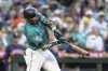 Seattle Mariners' Julio Rodriguez hits a two-run home run during the sixth inning of a baseball game against the Houston Astros, Saturday, July 20, 2024, in Seattle. (AP Photo/Stephen Brashear)