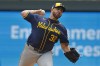 Milwaukee Brewers starting pitcher Aaron Civale throws to the Minnesota Twins in the first inning of a baseball game, Sunday, July 21, 2024, in Minneapolis. (AP Photo/Bruce Kluckhohn)