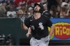 Chicago White Sox's Paul DeJong points upward while running the bases after hitting a home run during the ninth inning of a baseball game against the Texas Rangers in Arlington, Texas, Monday, July 22, 2024. (AP Photo/LM Otero)