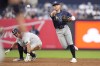 Tampa Bay Rays' Taylor Walls throws out New York Yankees' DJ LeMahieu at first base after forcing out New York Yankees' Anthony Volpe, left, during the second inning of a baseball game, Friday, July 19, 2024, in New York. (AP Photo/Frank Franklin II)