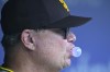 San Diego Padres manager Mike Shildt blows a bubble during the first inning inning of a baseball game against the Washington Nationals, Thursday, July 25, 2024, in Washington. (AP Photo/John McDonnell)