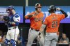 Baltimore Orioles' Ryan O'Hearn, left, is congratulated by Austin Hays (21) after hitting a solo home run off of Texas Rangers relief pitcher Jose Leclerc during the ninth inning of a baseball game Saturday, July 20, 2024, in Arlington, Texas. (AP Photo/Jeffrey McWhorter)