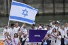 Israel's Andrea Murez and Peter Paltchik carry their country's flag in Paris, France, during the opening ceremony of the 2024 Summer Olympics, Friday, July 26, 2024. (AP Photo/Kirsty Wigglesworth)