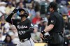 Miami Marlins' Bryan De La Cruz, left, gestures after hitting a two-run home run during the first inning of a baseball game against the Milwaukee Brewers, Friday, July 26, 2024, in Milwaukee. (AP Photo/Aaron Gash)