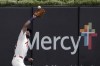 St. Louis Cardinals center fielder Michael Siani catches a fly ball by Washington Nationals' Lane Thomas during the fifth inning of a baseball game Friday, July 26, 2024, in St. Louis. (AP Photo/Jeff Roberson)