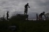 British team members practice at the Mountain Bike cycling track, at the 2024 Summer Olympics, Thursday, July 25, 2024, in Elancourt, France. (AP Photo/Ricardo Mazalan)