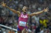 FILE - Sha'Carri Richardson, of the United States, celebrates after winning the gold medal in the final of the women's 100-meters during the World Athletics Championships in Budapest, Hungary, Aug. 21, 2023. (AP Photo/Petr David Josek, File)