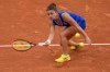 Jasmine Paolini of Italy returns the ball against Ana Bogdan of Romania during the women's singles tennis competition, at the 2024 Summer Olympics, Saturday, July 27, 2024, in Paris, France. (AP Photo/Manu Fernandez)