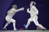 Hungary's Aron Szilagyi, left, and Canada's Fares Arfa compete in the men's individual Sabre round of 32 competition during the 2024 Summer Olympics at the Grand Palais, Saturday, July 27, 2024, in Paris, France. THE CANADIAN PRESS/AP/Andrew Medichini