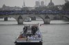Israel and Italy, top, teams parade along the Seine river in Paris, France, during the opening ceremony of the 2024 Summer Olympics, Friday, July 26, 2024.. (AP Photo/Christophe Ena)