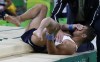 FILE - France's Samir Ait Said holds his leg after injuring it while performing on the vault during the artistic gymnastics men's qualification at the 2016 Summer Olympics in Rio de Janeiro, Brazil, Aug. 6, 2016. (AP Photo/Rebecca Blackwell, File)