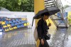 A guest walks by the exhibition about war-torn sport infrastructures ahead of the opening event of Ukraine House at the 2024 Summer Olympics in Paris, France, Saturday, July 27, 2024. (AP Photo/Hanna Arhirova)