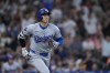 Los Angeles Dodgers designated hitter Shohei Ohtani runs the bases after hitting a solo home during the third inning of a baseball game against the Houston Astros, Saturday, July 27, 2024, in Houston. (AP Photo/Kevin M. Cox)