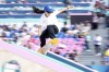Funa Nakayama, of Japan, performs a trick during the women's skateboard street preliminaries at the 2024 Summer Olympics, Sunday, July 28, 2024, in Paris, France. (AP Photo/Vadim Ghirda)