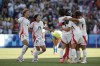 Japan's players celebrate after winning against Brazil, during the women's group C match between Brazil and Japan at the Parc des Princes, during the 2024 Summer Olympics, Sunday, July 28, 2024, in Paris, France. (AP Photo/Aurelien Morissard)