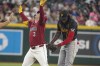 Arizona Diamondbacks' Joc Pederson (3) humorously overreacts after Pittsburgh Pirates shortstop Oneil Cruz, right, playfully tagged him after he hit a double during the fourth inning of a baseball game Sunday, July 28, 2024, in Phoenix. (AP Photo/Darryl Webb)