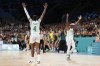 Elizabeth Balogun (4) and Promise Amukamara, of Nigeria, celebrate in a women's basketball game against Australia at the 2024 Summer Olympics, Monday, July 29, 2024, in Villeneuve-d'Ascq, France. (AP Photo/Mark J. Terrill)