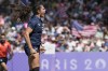 United States' Ilona Maher celebrates after scoring a try during the women's Pool C Rugby Sevens match between France and the United States at the 2024 Summer Olympics, in the Stade de France, in Saint-Denis, France, Monday, July 29, 2024. (AP Photo/Tsvangirayi Mukwazhi)
