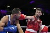Canada's Wyatt Sanford hits Bulgaria's Radoslav Rosenov in their men's 63.5 kg preliminary boxing match at the 2024 Summer Olympics, Monday, July 29, 2024, in Paris, France. THE CANADIAN PRESS/AP-Ariana Cubillos