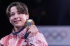 Canada's Christa Deguchi holds her gold medal after her win in the women's under-57 kg judo at the 2024 Summer Olympics in Paris, France on Monday, July 29, 2024. THE CANADIAN PRESS/Christinne Muschi