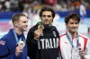 Gold medalist Thomas Ceccon, of Italy, poses with silver medalist Xu Jiayu, of China, left, and bronze medalist Ryan Murphy, of the United States, after the men's 100-meter backstroke final at the 2024 Summer Olympics, Monday, July 29, 2024, in Nanterre, France. (AP Photo/Martin Meissner)