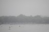 Rowers warm up ahead of competition on a rainy day at the 2024 Summer Olympics, Saturday, July 27, 2024, in Vaires-sur-Marne, France. (AP Photo/Lindsey Wasson)