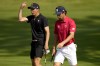 Joaquin Niemann, of Chile, right, and Carlos Ortiz, of Mexico, walk up the third green during a practice round for the men's golf event at the 2024 Summer Olympics, Tuesday, July 30, 2024, at Le Golf National in Saint-Quentin-en-Yvelines, France. (AP Photo/Matt York)
