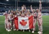 The women's rugby team poses for a team photo after winning the silver medal in the women's rugby sevens final action at the Summer Olympics in Paris, Monday, July 29, 2024. THE CANADIAN PRESS/Adrian Wyld