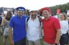Three fans dressed in the color of the French flag, Martin Puyge, left, André Marais, center, and Philippe Bouju, right, in Club France, an Olympic fan zone, in northern Paris, France, Tuesday, July 30, 2024. (AP Photo/Tom Nouvian)
