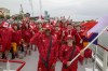 Canada's flag-bearers Maude Charron, right, and Andre de Grasse, left, pose for photos on a boat with their team before the start of the opening ceremony for the 2024 Summer Olympics on the Seine River in Paris, France, Friday, July 26, 2024. THE CANADIAN PRESS/AP-Cao Can