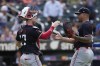 Minnesota Twins catcher Ryan Jeffers, left, and pitcher Jhoan Duran celebrate after a baseball game against the New York Mets at Citi Field, Wednesday, July 31, 2024, in New York. The Twins defeated the Mets 8-3. (AP Photo/Seth Wenig)