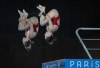 Divers Caeli McKay, from Calgary, and Kate Miller, from Ottawa, compete in the women's synchronized 10m platform diving finals, Wednesday, July 31, 2024 in Paris. The pair placed fourth in the event. THE CANADIAN PRESS/Adrian Wyld
